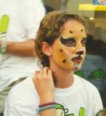 Lisa with her face painted like a tiger baby!
